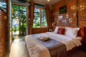 Postel nebo postele na pokoji v ubytování Robins Guesthouse