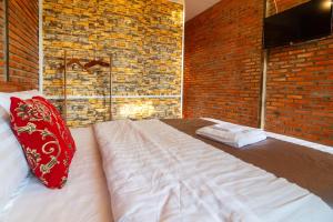 Postel nebo postele na pokoji v ubytování Robins Guesthouse
