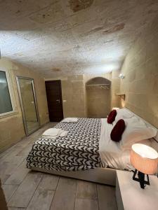 a bedroom with a large bed in a room at Perla Marina in Monopoli +1 photo