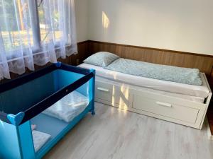 Postel nebo postele na pokoji v ubytování Chata Pod Kopcem