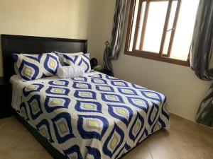Postel nebo postele na pokoji v ubytování Appartement climatisé vue piscine - Lilacs garden CaboNegro