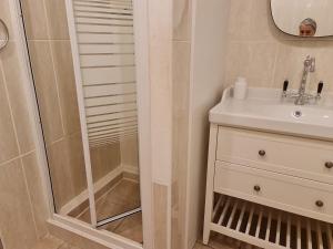 a bathroom with a shower and a sink at Casa dos Arcos in Olhos de Água +19 photos