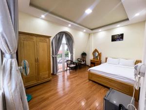 Postel nebo postele na pokoji v ubytování Phùng Thịnh Hotel