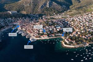 an aerial view of a city with boats in the water at Up&Above ,New Luxury Apt, Steps from Beach and Old Town in Hvar