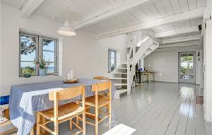 a dining room with a table and chairs at Awesome Home In Knebel With Kitchen in Knebel
