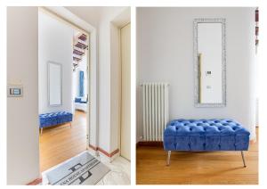 a room with a blue ottoman and a mirror at Elena House Apartments in Viareggio
