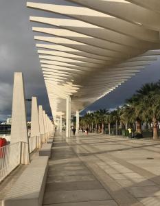 a view of the underside of a pavilion with palm trees at Premium Historic Center & Parking in Málaga