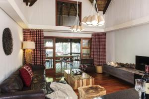 a living room with a couch and a table at Emerald Resort & Casino in Vanderbijlpark