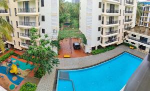 an overhead view of an apartment complex with a swimming pool at Kp's Patnem Beach Apartment in Canacona