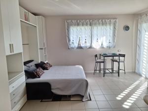 Postel nebo postele na pokoji v ubytování M.D.A.