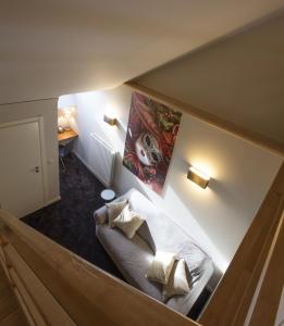 a view of a living room with a couch at Theater Hotel Leuven Centrum in Leuven