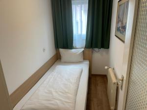 Letto o letti in una camera di Hafner Hotel Apartment Self Check-In Anytime