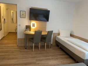 Letto o letti in una camera di Hafner Hotel Apartment Self Check-In Anytime
