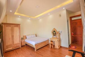 Postel nebo postele na pokoji v ubytování Phùng Thịnh Hotel