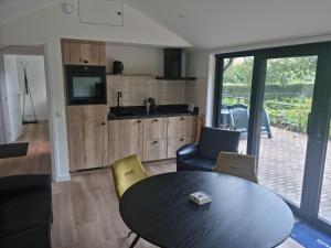 Kuchyň nebo kuchyňský kout v ubytování vakantiehuis en appartement De Harscamp