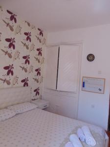Postel nebo postele na pokoji v ubytování Guest House Ivan