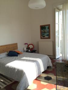 Ліжко або ліжка в номері Casa di Marisa