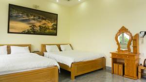 Postel nebo postele na pokoji v ubytování Phùng Thịnh Hotel