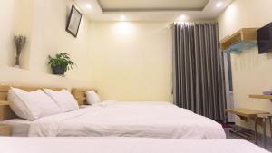 Postel nebo postele na pokoji v ubytování Phùng Thịnh Hotel