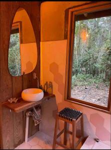 a bathroom with a sink and a large window at Vila Dravida Petar in Iporanga +34 photos