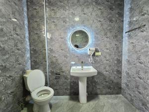 a bathroom with a toilet and a sink at Maikostan in Shuakhevi +25 photos