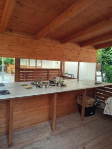 a kitchen with a large counter in a house at Villa Janilla in Dhërmi