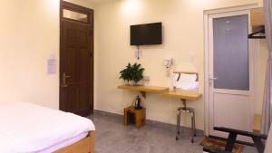 TV a/nebo společenská místnost v ubytování Phùng Thịnh Hotel