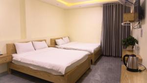 Postel nebo postele na pokoji v ubytování Phùng Thịnh Hotel