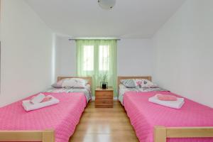 Postel nebo postele na pokoji v ubytování Apartment Nina
