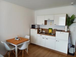 Kuchyň nebo kuchyňský kout v ubytování Apartment Auszeit Strobl