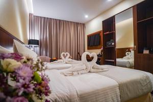 Ένα ή περισσότερα κρεβάτια σε δωμάτιο στο Emaar Elite Hotel