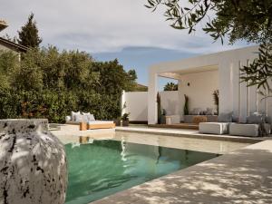 a villa with a swimming pool and a house at The White Luxury Villa - Private Seaview Villa with Pool by Villa Mana Gers in Vasilikos