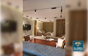a living room with a couch and a table at للايجار ايام الصيف فيلا فاخره بستيلا هايتس - الساحل الشمالي in El Alamein