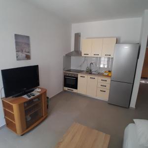 Kuchyň nebo kuchyňský kout v ubytování Apartments Jurjevic