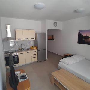Kuchyň nebo kuchyňský kout v ubytování Apartments Jurjevic