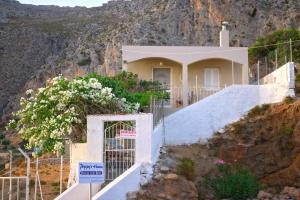 a house on the side of a mountain at Poppy's House in Emborios Kalymnos