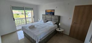 Postel nebo postele na pokoji v ubytování Elizabeta Apartments