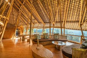 a room with a couch and chairs in a building at Sunrise House 3bd Bamboo Villa Pool in Bringkit +34 photos