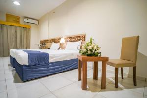 Voodi või voodid majutusasutuse Osturat Emaar Hotel toas