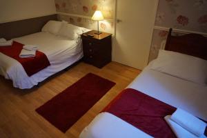Letto o letti in una camera di The Boundary Hotel - B&B