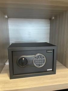 a black speaker sitting on top of a shelf at Rent Studio2 full furnished in Jakarta