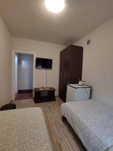 Ένα ή περισσότερα κρεβάτια σε δωμάτιο στο Coco Studio Apartment
