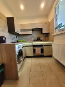 Kuchnia lub aneks kuchenny w obiekcie Apartament Centrum - Aleja Świętego Jana Pawła II