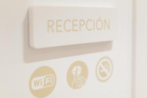 a door with a sign that reads regrigerator at Pension Del Mar in San Sebastián