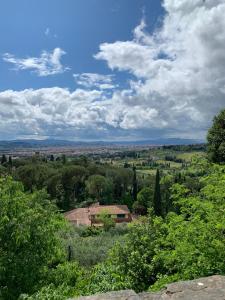 a view of the countryside from a hill with a house at Oro Blanco in Florence