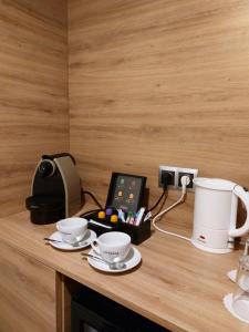 Příslušenství pro přípravu čaje a kávy v ubytování Novotel Vilnius Centre