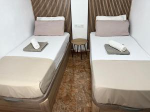 Posteľ alebo postele v izbe v ubytovaní Santomera 1st Line