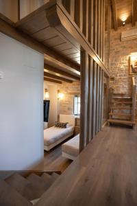 Postel nebo postele na pokoji v ubytování Akrolithi Guesthouse