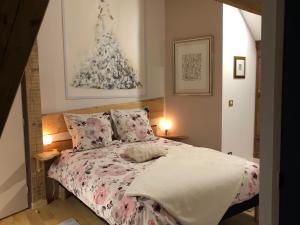 Una cama o camas en una habitación de Gite le ptit Corpatus