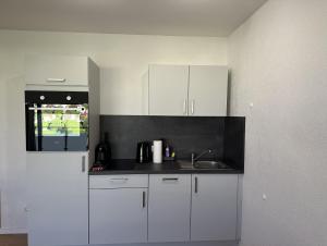 Η κουζίνα ή μικρή κουζίνα στο CloudCabins Dornstetten - Marktplatz +20 φωτογραφίες